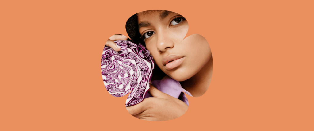 A graphic content with slight reveal of the image of a woman holding a purple flower product